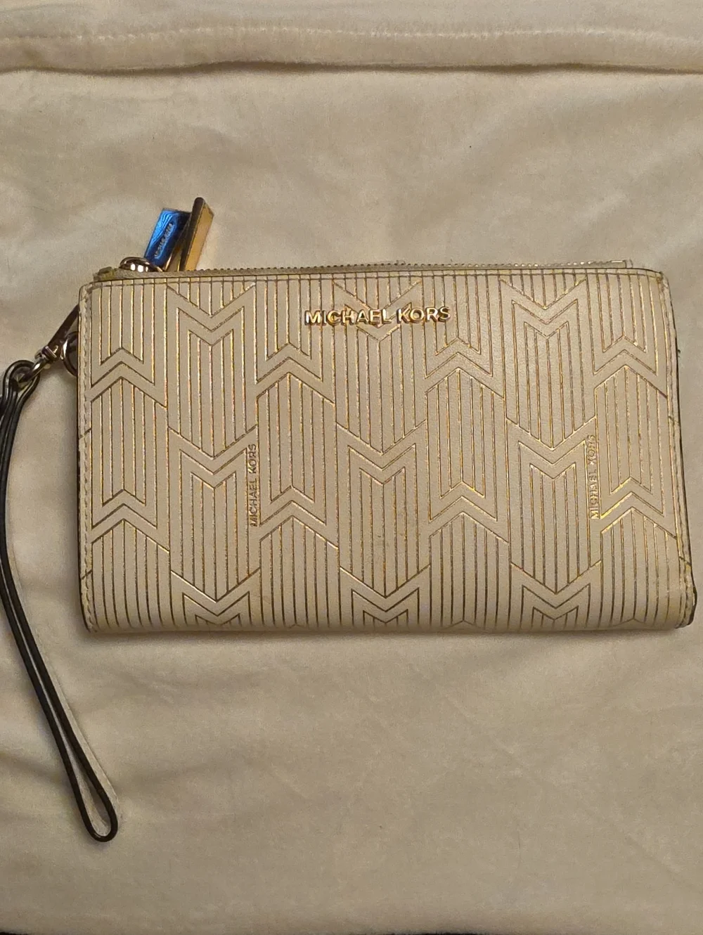 Michael Kors Cream Embossed Wristlet with Gold Accents